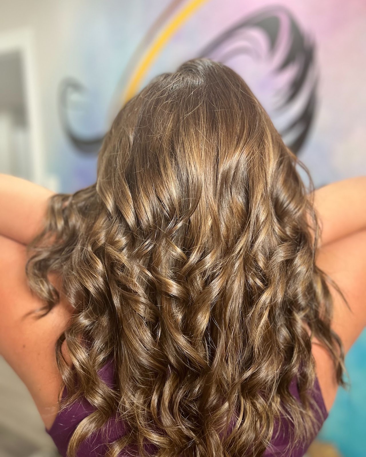 Dimensional brunette highlights with soft curls at HairSense